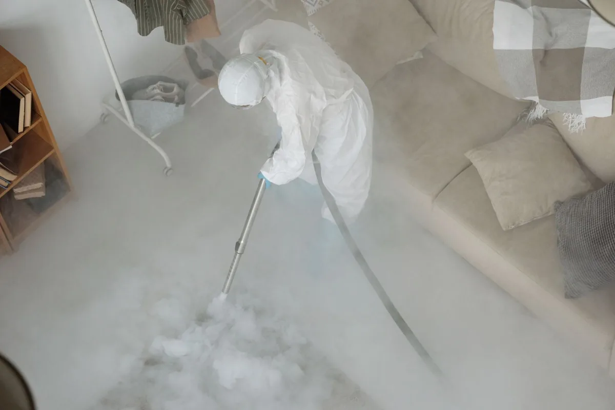 Biohazard cleanup technician in protective equipment, Marked Tree, AR
